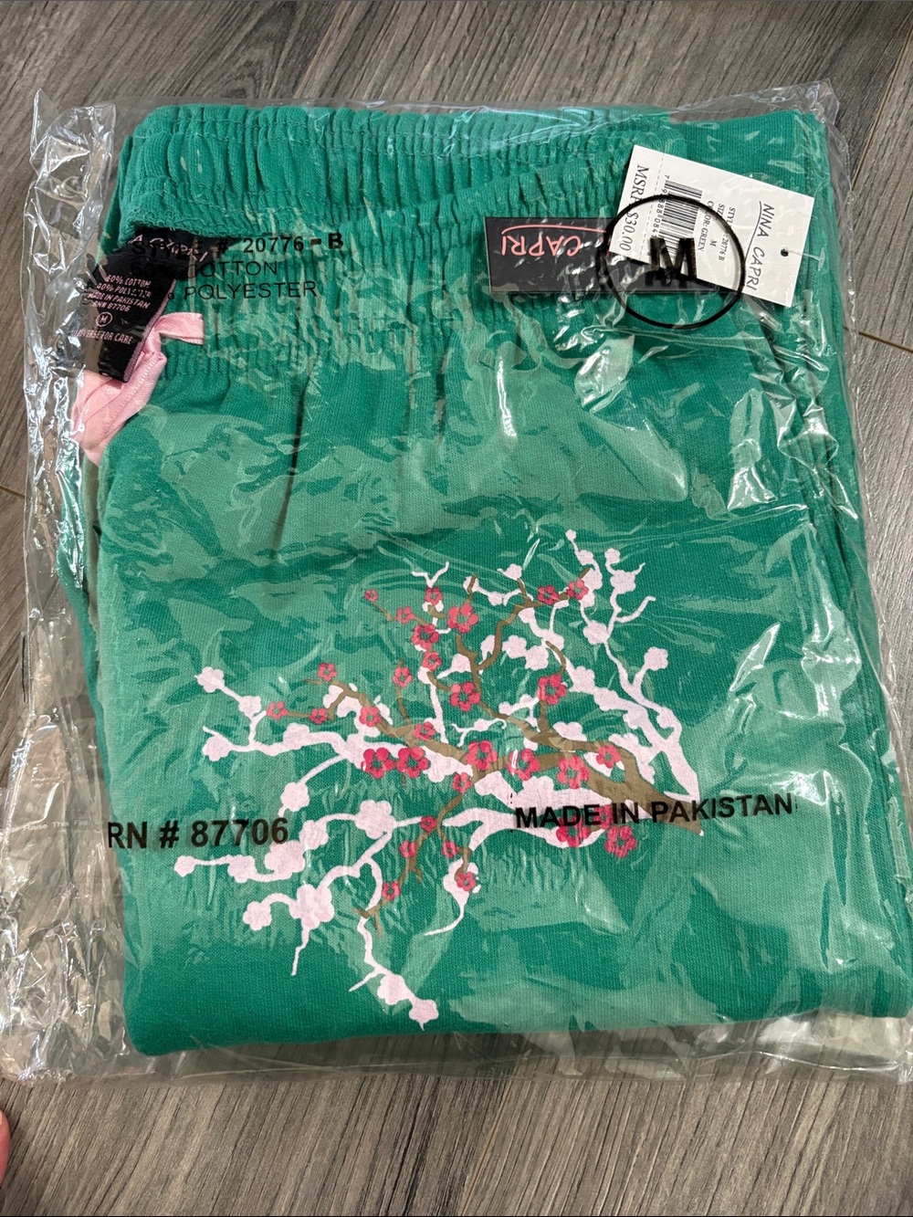 Nina Capri Teal-Green Sweatpants with Black Tag and Pink Logo